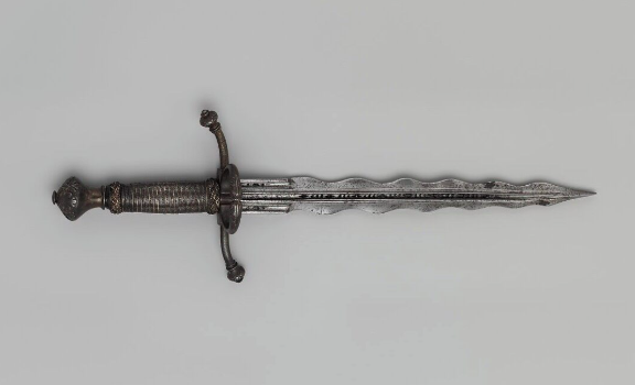 A Renaissance-era Italian parrying dagger crafted from steel with a distinctive fluted blade, dating to approximately AD 1550–1575.⁣